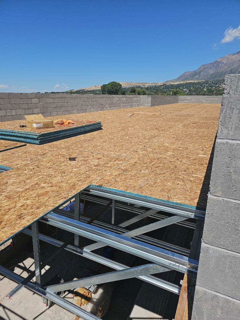 Steel floor truss deck sheathed and ready for the next level of a commercial structure